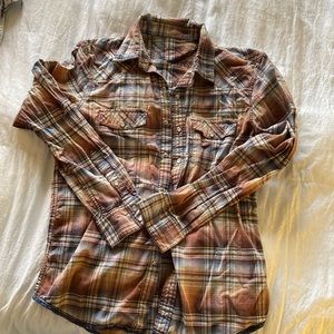 Men’s small snap from flannel design shirt.